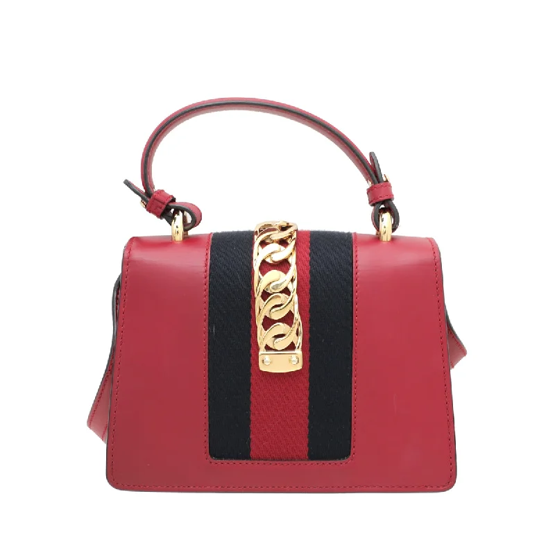 Gucci Marmont bags for women with gold - toned hardwareGucci Red Sylvie Top Handle Mini Bag